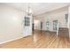 Open-concept living room featuring hardwood floors, vaulted ceilings, and a staircase at 1015 Boathouse Ct, Raleigh, NC 27615