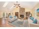 Spacious living room with vaulted ceilings, brick fireplace and built-in bookshelves at 1015 Boathouse Ct, Raleigh, NC 27615