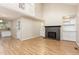 Spacious living room with a brick fireplace and built-in bookshelves at 1015 Boathouse Ct, Raleigh, NC 27615