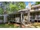 Features a cozy screened porch area surrounded by mature trees, creating a relaxing outdoor retreat at 1015 Boathouse Ct, Raleigh, NC 27615