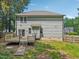 Exterior view of the backyard, deck, and side of the house at 10504 Carsons Creek Dr, Zebulon, NC 27597