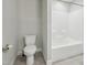 Bathroom featuring a toilet and shower and tub combination at 10504 Carsons Creek Dr, Zebulon, NC 27597