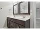 Bathroom featuring a double vanity with dark wood cabinetry at 10504 Carsons Creek Dr, Zebulon, NC 27597
