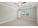 Bedroom with a ceiling fan, carpeted floor, neutral walls, and a view to the yard at 10504 Carsons Creek Dr, Zebulon, NC 27597