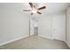 Bedroom featuring a ceiling fan and two entry points at 10504 Carsons Creek Dr, Zebulon, NC 27597