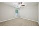 Cozy bedroom featuring a ceiling fan and window at 10504 Carsons Creek Dr, Zebulon, NC 27597