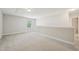 Spacious bonus room with carpet, natural light, and additional room for storage at 10504 Carsons Creek Dr, Zebulon, NC 27597