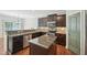 Bright kitchen boasts stainless steel appliances, a center island, and views of the dining area at 10504 Carsons Creek Dr, Zebulon, NC 27597