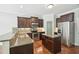 Modern kitchen with an island, stainless steel appliances, and granite countertops at 10504 Carsons Creek Dr, Zebulon, NC 27597