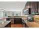 Stylish kitchen with stainless steel appliances, granite counters and backsplash at 10504 Carsons Creek Dr, Zebulon, NC 27597