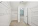 Spacious walk-in closet with metal shelving and access to the bedroom at 10504 Carsons Creek Dr, Zebulon, NC 27597