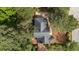 Aerial shot of the house, showing roof, landscaping and mature trees surrounding the home at 106 Windstream Way, Cary, NC 27518