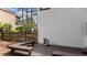 A spacious backyard with a wooden deck, benches, and fenced yard offers space for relaxing and entertaining at 106 Windstream Way, Cary, NC 27518