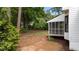 A large back yard with mature trees offers ample space for outdoor activities and relaxation at 106 Windstream Way, Cary, NC 27518