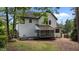Spacious backyard with lawn and a screened in porch at 106 Windstream Way, Cary, NC 27518