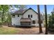 Backyard features a screened in porch, a dark roof, and white sidings at 106 Windstream Way, Cary, NC 27518