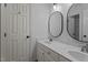 Bathroom with a double vanity sink and framed mirrors at 106 Windstream Way, Cary, NC 27518