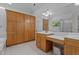 Bathroom with wooden cabinets, vanity with sink, tub, and large mirror with lighting at 106 Windstream Way, Cary, NC 27518