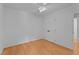 Bedroom featuring hardwood floors, a ceiling fan and closet with double doors at 106 Windstream Way, Cary, NC 27518