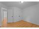 Bedroom featuring hardwood floors, double door closet and white walls at 106 Windstream Way, Cary, NC 27518