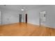 Bright bedroom with hardwood floors, ceiling fan, and doors to closet and bathroom at 106 Windstream Way, Cary, NC 27518