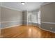 Bright dining room featuring a bay window with backyard views and neutral wall colors at 106 Windstream Way, Cary, NC 27518