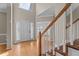 Spacious foyer with hardwood floors, staircase, and plenty of natural light at 106 Windstream Way, Cary, NC 27518