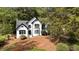 Traditional home with white brick, black trim, and beautiful front yard at 106 Windstream Way, Cary, NC 27518