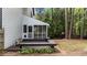 Back porch with benches, a screened-in area, and access to backyard at 106 Windstream Way, Cary, NC 27518