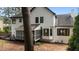 The screened porch on the rear of the house has an entry door plus views to a bay window at 106 Windstream Way, Cary, NC 27518