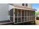 An inviting screened porch offers a peaceful retreat and a comfortable outdoor living space at 106 Windstream Way, Cary, NC 27518
