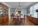 Formal dining room with chandelier, crown molding, and arched doorway at 10608 Thornbury Crest Ct Ct, Raleigh, NC 27614