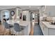 Bright kitchen featuring white cabinets, a spacious island with seating, and modern appliances at 10608 Thornbury Crest Ct Ct, Raleigh, NC 27614