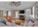 Open concept living room with fireplace, views to the dining area and lots of natural light at 10608 Thornbury Crest Ct Ct, Raleigh, NC 27614