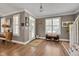 Bright living room features hardwood floors, white trim, and ample natural light at 10608 Thornbury Crest Ct Ct, Raleigh, NC 27614