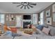 Comfortable living room with a fireplace, large windows, and stylish decor at 10608 Thornbury Crest Ct Ct, Raleigh, NC 27614