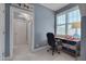 Bright office with a blue accent wall, modern desk, and an airplane picture over a doorway at 10608 Thornbury Crest Ct Ct, Raleigh, NC 27614