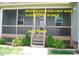 Rear screened in back porch with stairway at 107 Norwood Dr, Clayton, NC 27527