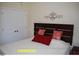 Cozy bedroom with a comfortable bed, decorative headboard, and ample natural light at 107 Norwood Dr, Clayton, NC 27527