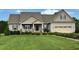 Charming single-Gathering home featuring a manicured lawn, neutral siding and an attached two-car garage at 107 Norwood Dr, Clayton, NC 27527