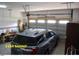 Two car garage with ample storage space and overhead door system at 107 Norwood Dr, Clayton, NC 27527