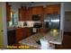 Well-equipped kitchen with stainless steel appliances, granite countertops, and an island with seating at 107 Norwood Dr, Clayton, NC 27527