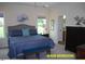 Serene main bedroom featuring a large bed, neutral colors, and an en-suite bathroom at 107 Norwood Dr, Clayton, NC 27527