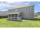 A spacious backyard featuring a screened porch perfect for outdoor relaxation and entertaining at 107 Southern Acres Dr, Fuquay Varina, NC 27526