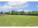 Expansive backyard featuring a well-maintained lawn and privacy fencing at 107 Southern Acres Dr, Fuquay Varina, NC 27526