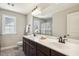 Bathroom with double sink vanity with marble countertops at 107 Southern Acres Dr, Fuquay Varina, NC 27526