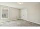 Bedroom features new gray carpeting and a window at 107 Southern Acres Dr, Fuquay Varina, NC 27526