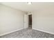 Bedroom features neutral walls and new gray carpeting at 107 Southern Acres Dr, Fuquay Varina, NC 27526