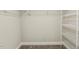 Walk-in closet with carpet and white shelving at 107 Southern Acres Dr, Fuquay Varina, NC 27526