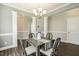 Spacious dining room with wainscoting and adjacent rooms at 107 Southern Acres Dr, Fuquay Varina, NC 27526